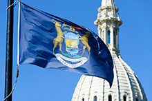 State of Michigan Capitol and State Flag