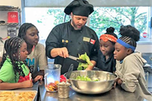 Flint Kids Cook in class with chef