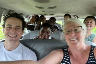 Dr. Connie Currier takes a selfie with MPH students in Ghana