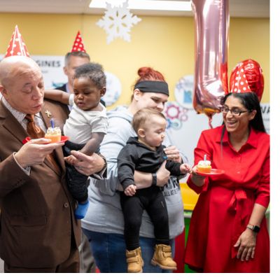 Flint Mayor Neeley, Rx Kids babies, and Mona Hanna celebrate Rx Kids with cupcakes